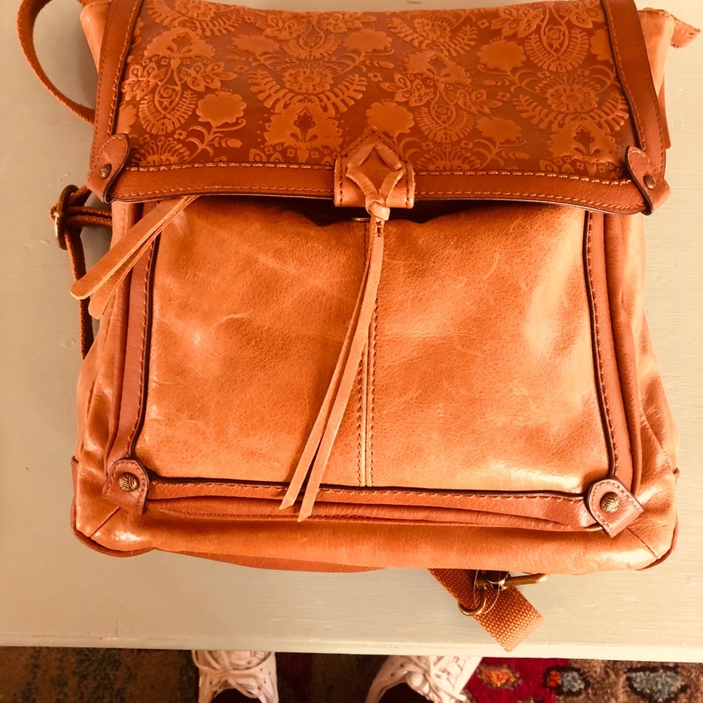 A large Real Leather Bag/Backpack With Designs
